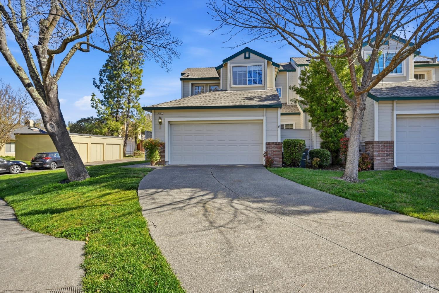 1005 Woodlake Drive Santa Rosa, CA 95405 - Photo 24 of 28 a front view of a house with a yard and garage