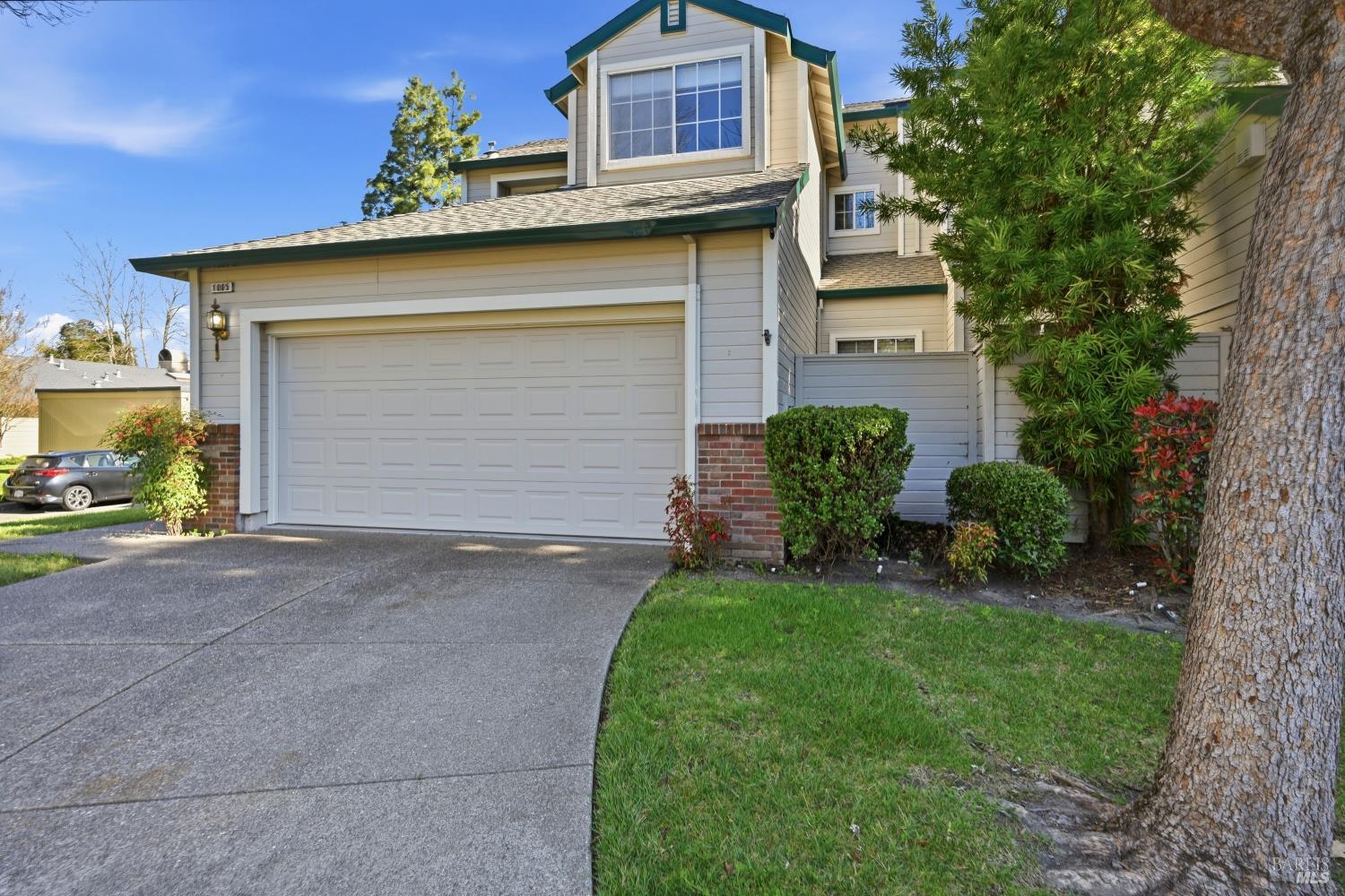 1005 Woodlake Drive Santa Rosa, CA 95405 - Photo 4 of 28 a view of a house with a yard and garage