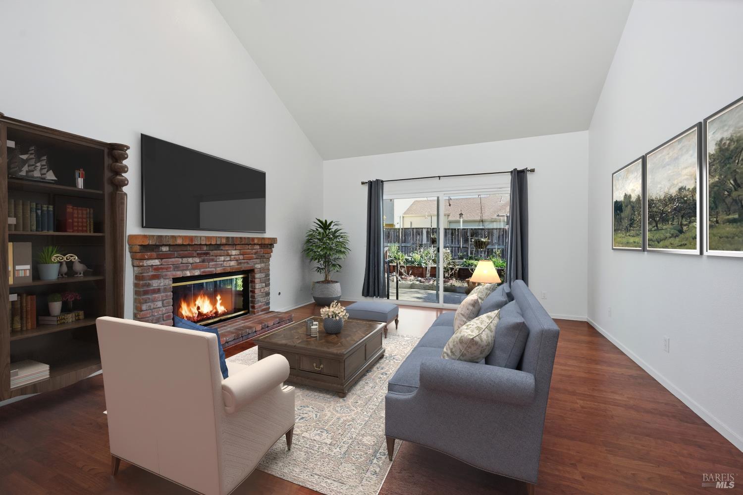 1005 Woodlake Drive Santa Rosa, CA 95405 - Photo 6 of 28 a living room with furniture a fireplace and a flat screen tv