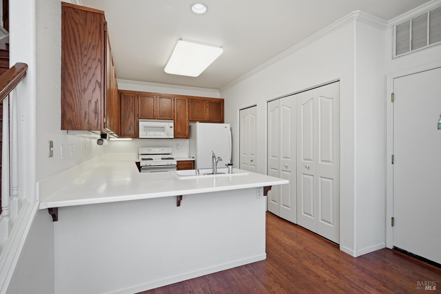 1005 Woodlake Drive Santa Rosa, CA 95405 - Photo 8 of 28 a kitchen with a sink a stove and cabinets