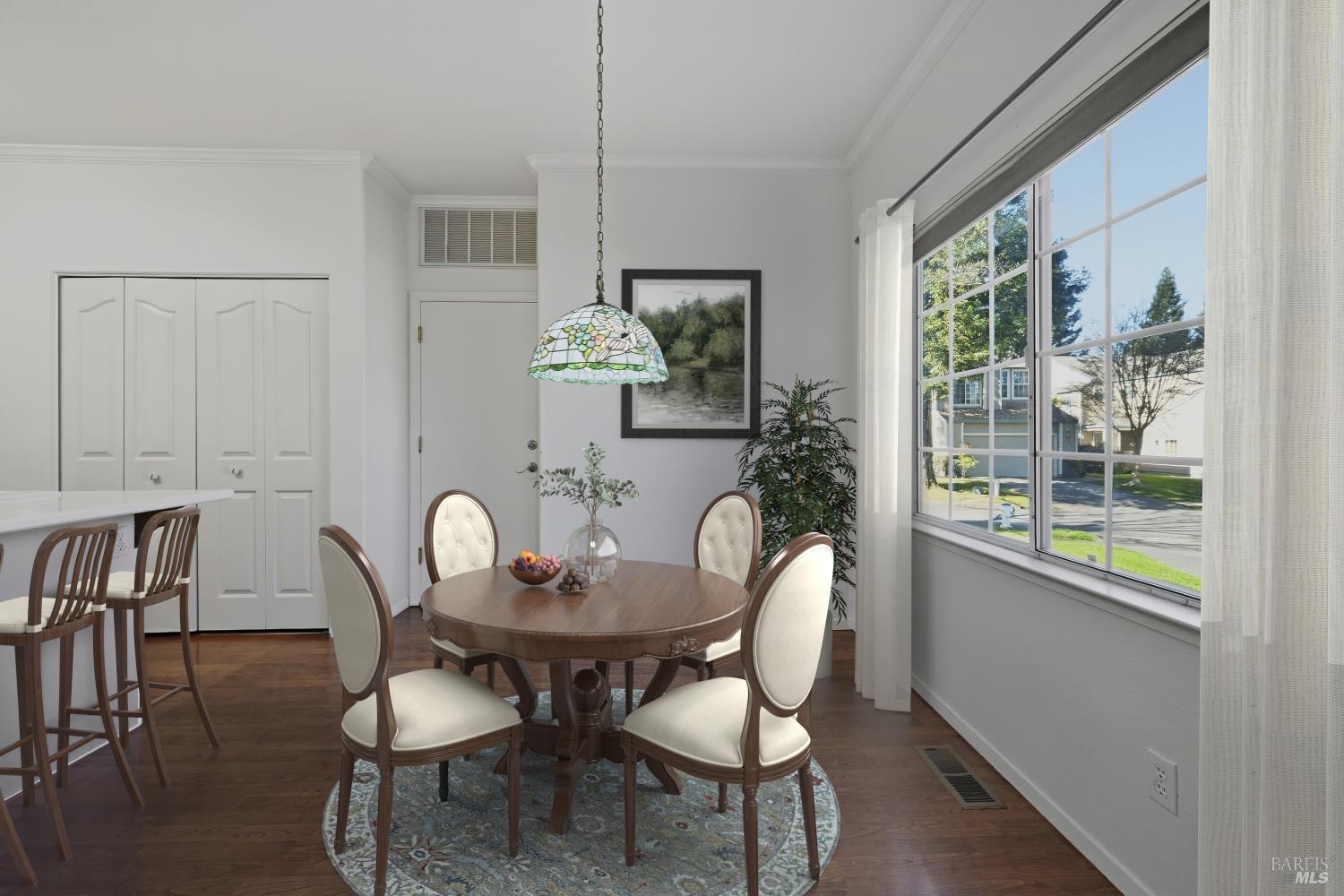 1005 Woodlake Drive Santa Rosa, CA 95405 - Photo 10 of 28 a dining room with furniture a window and a chandelier