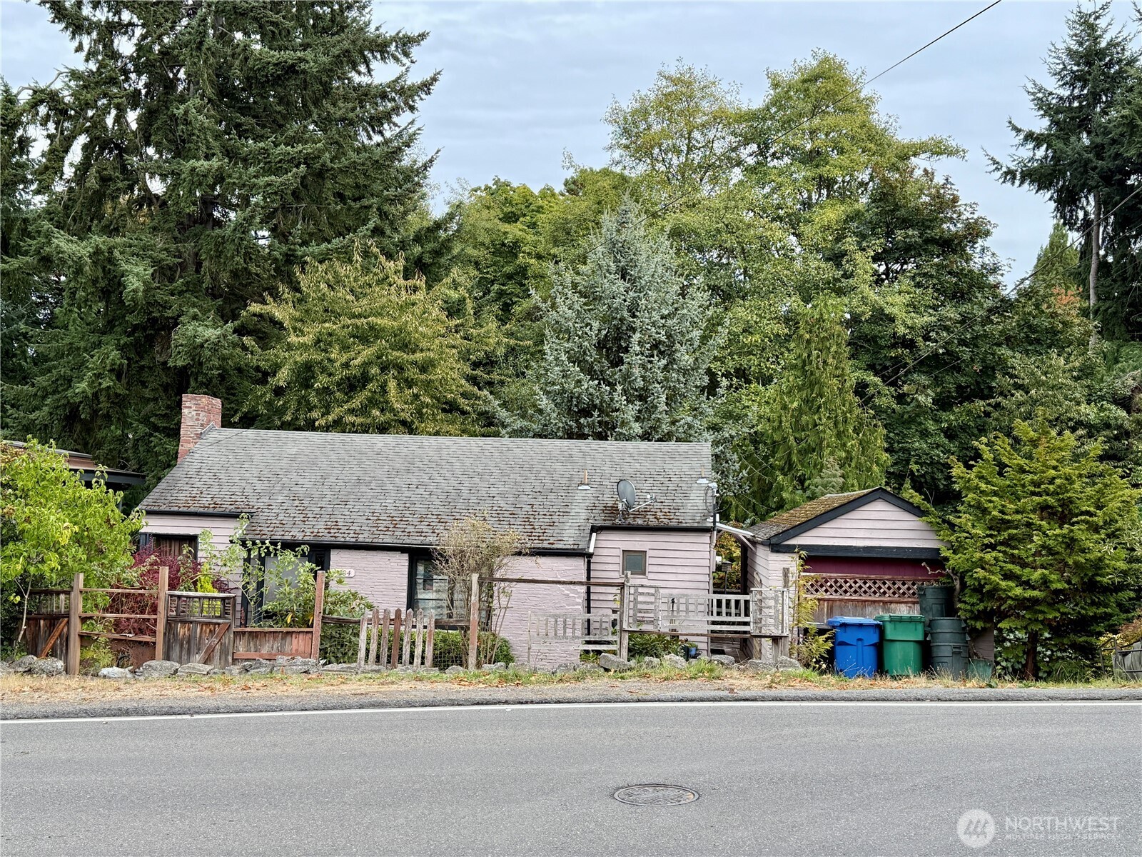 9104 28th Avenue Northwest Seattle, WA 98117 - Photo 1 of 5 front view of a house with a street