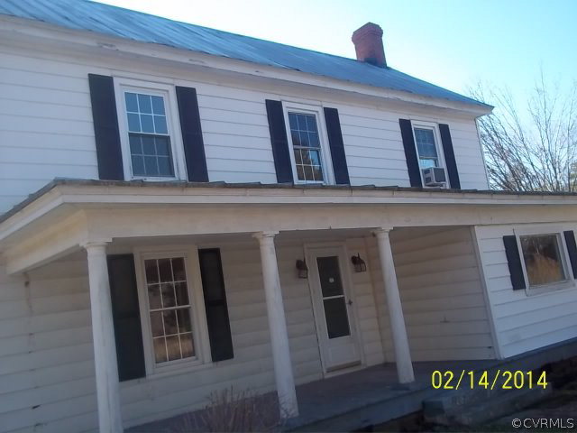 359 Sandy Road Diggs, VA 23045 - Photo 1 of 9 a building that has a lot of windows