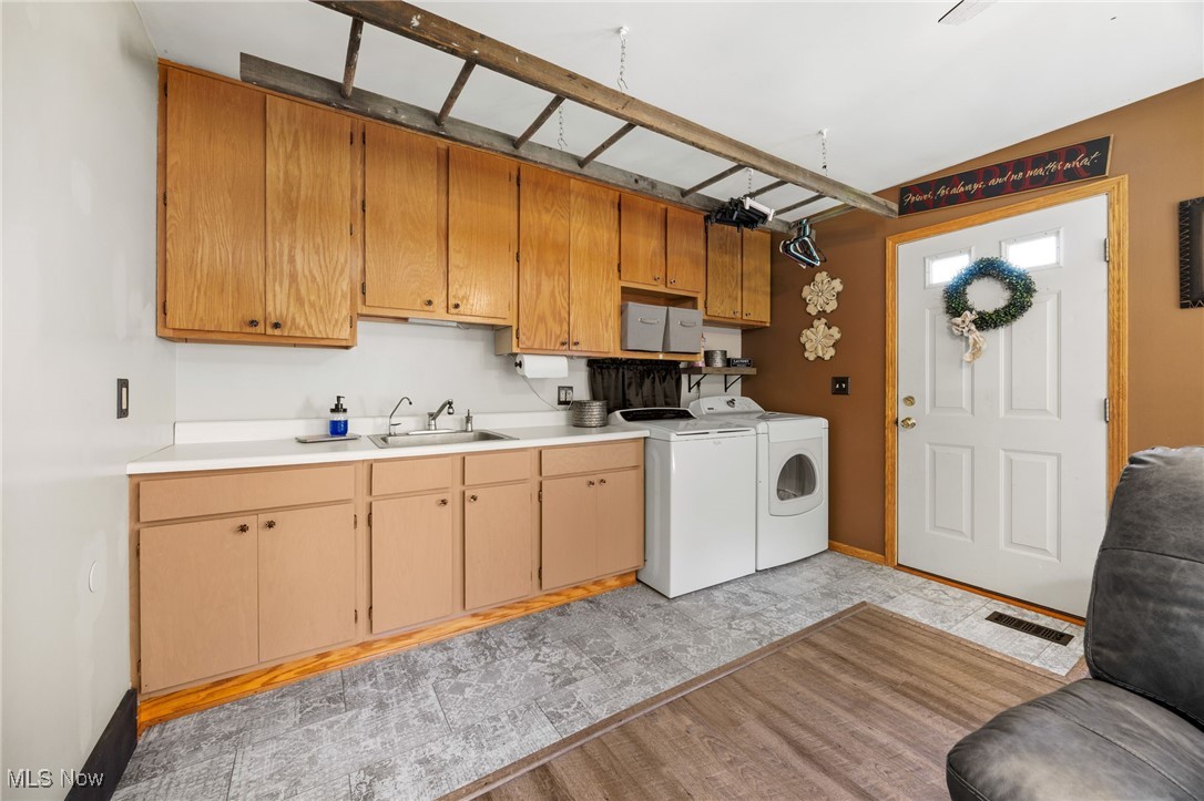 11827 Stratton Road West Salem, OH 44287 - Photo 27 of 47 Laundry room featuring cabinet space and washing machine and clothes dryer