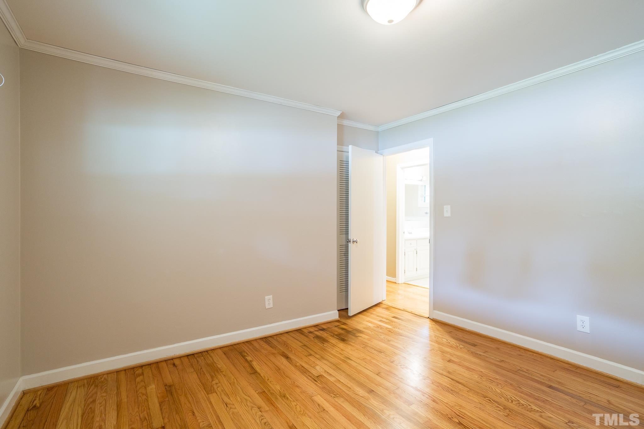 3620 Marsh Creek Road Raleigh, NC 27604 - Photo 15 of 25 a view of an empty room and wooden floor