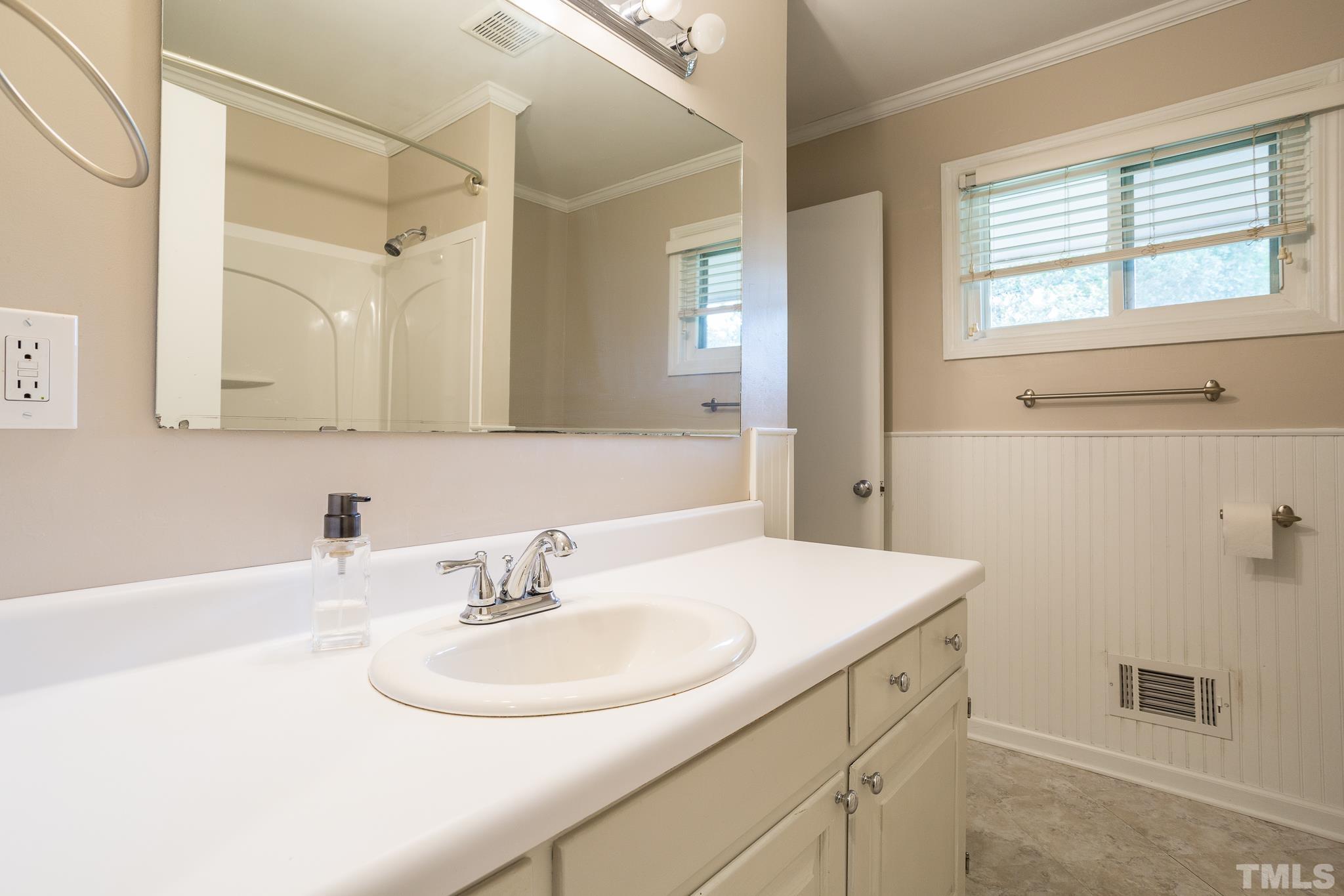 3620 Marsh Creek Road Raleigh, NC 27604 - Photo 21 of 25 a bathroom with a sink and a mirror