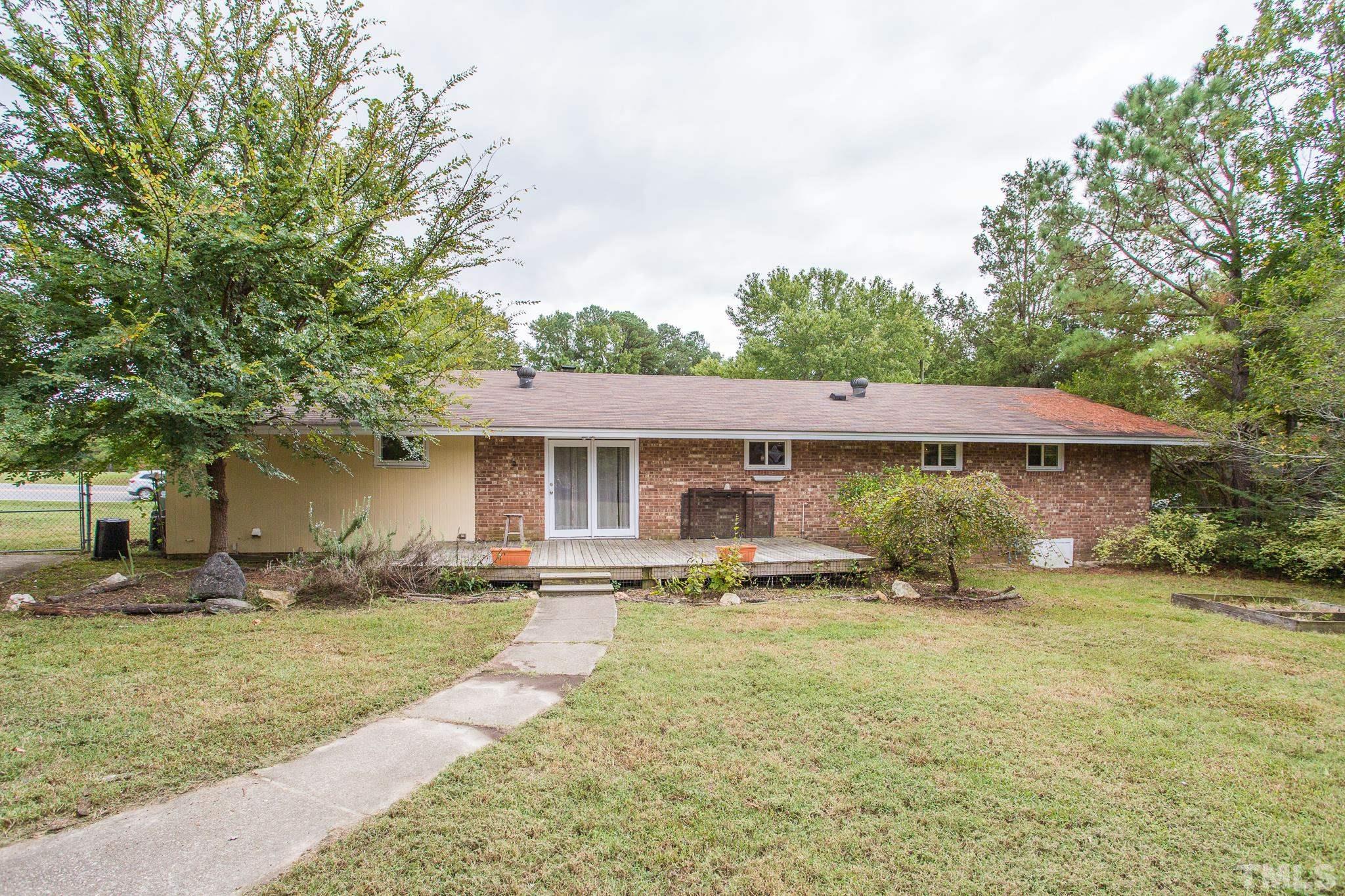 3620 Marsh Creek Road Raleigh, NC 27604 - Photo 22 of 25 a front view of a house with yard patio and green space