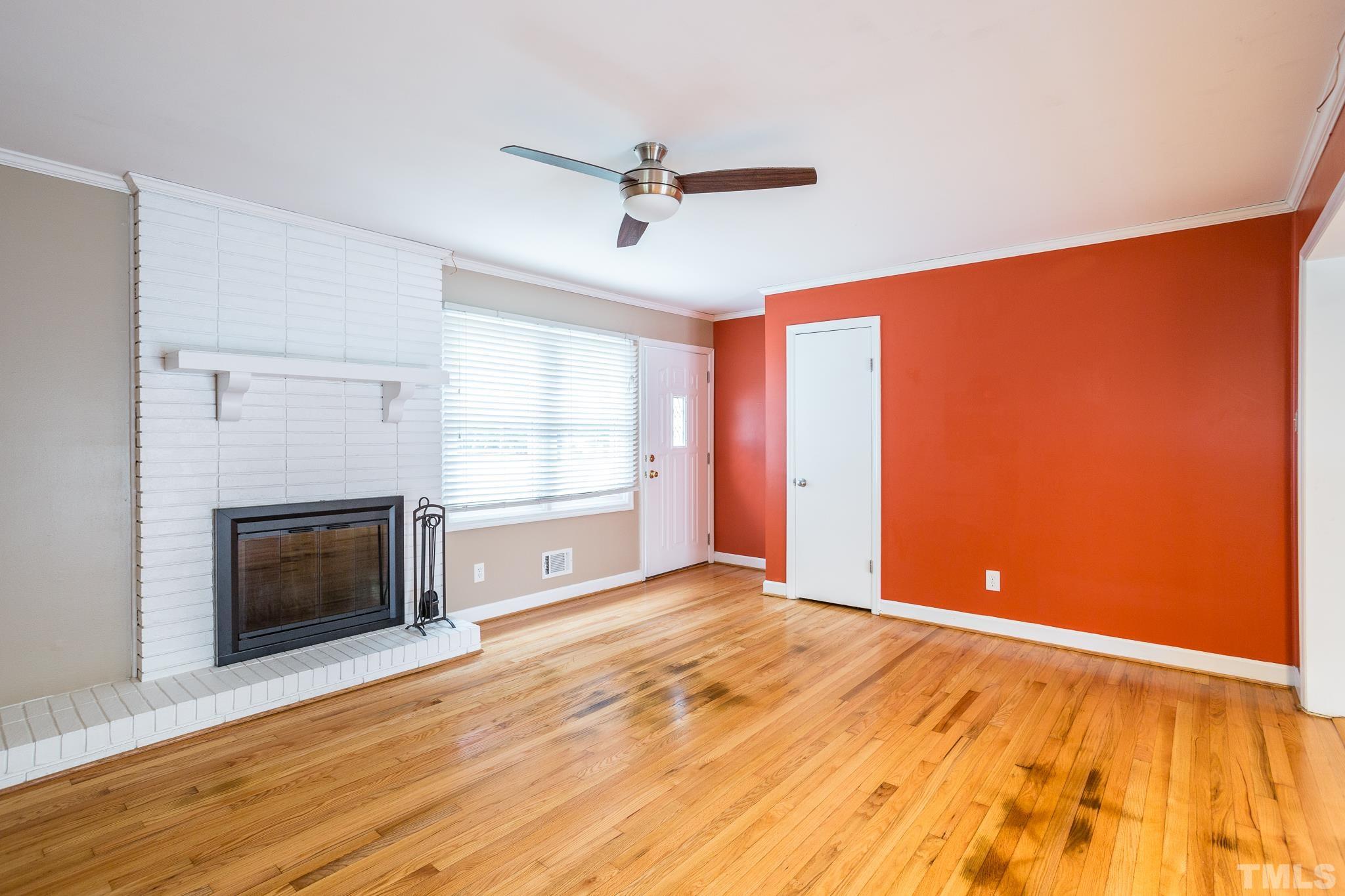 3620 Marsh Creek Road Raleigh, NC 27604 - Photo 9 of 25 a view of an empty room with a fireplace and a window