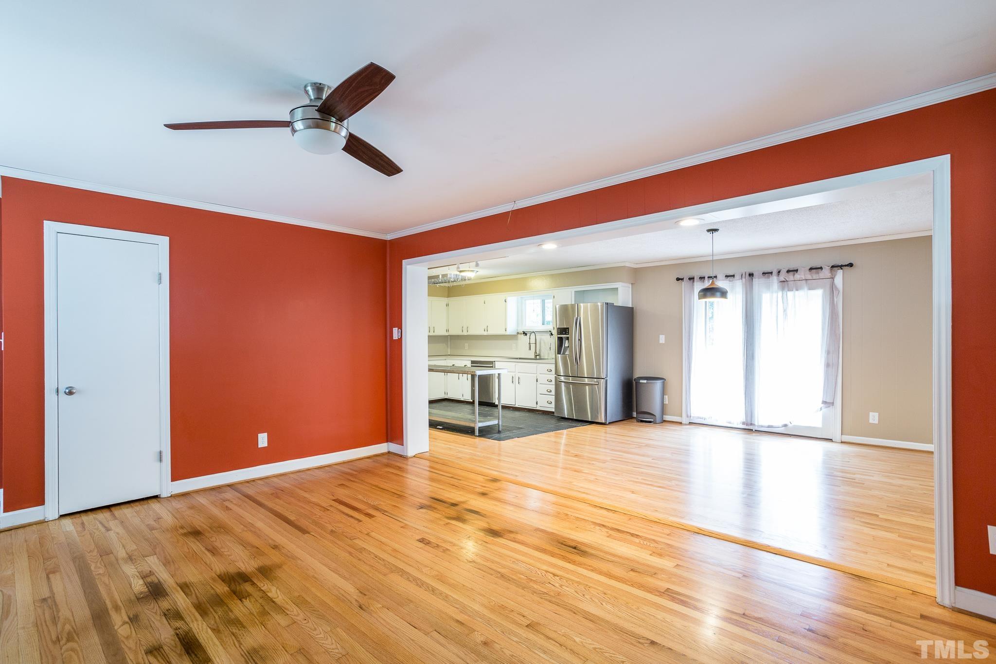 3620 Marsh Creek Road Raleigh, NC 27604 - Photo 10 of 25 a view of an empty room with wooden floor and a window