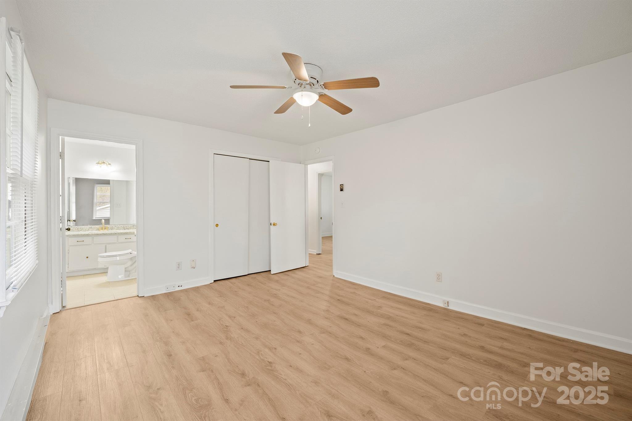 303 Windy Rush Road Kannapolis, NC 28081 - Photo 21 of 30 a view of empty room with wooden floor