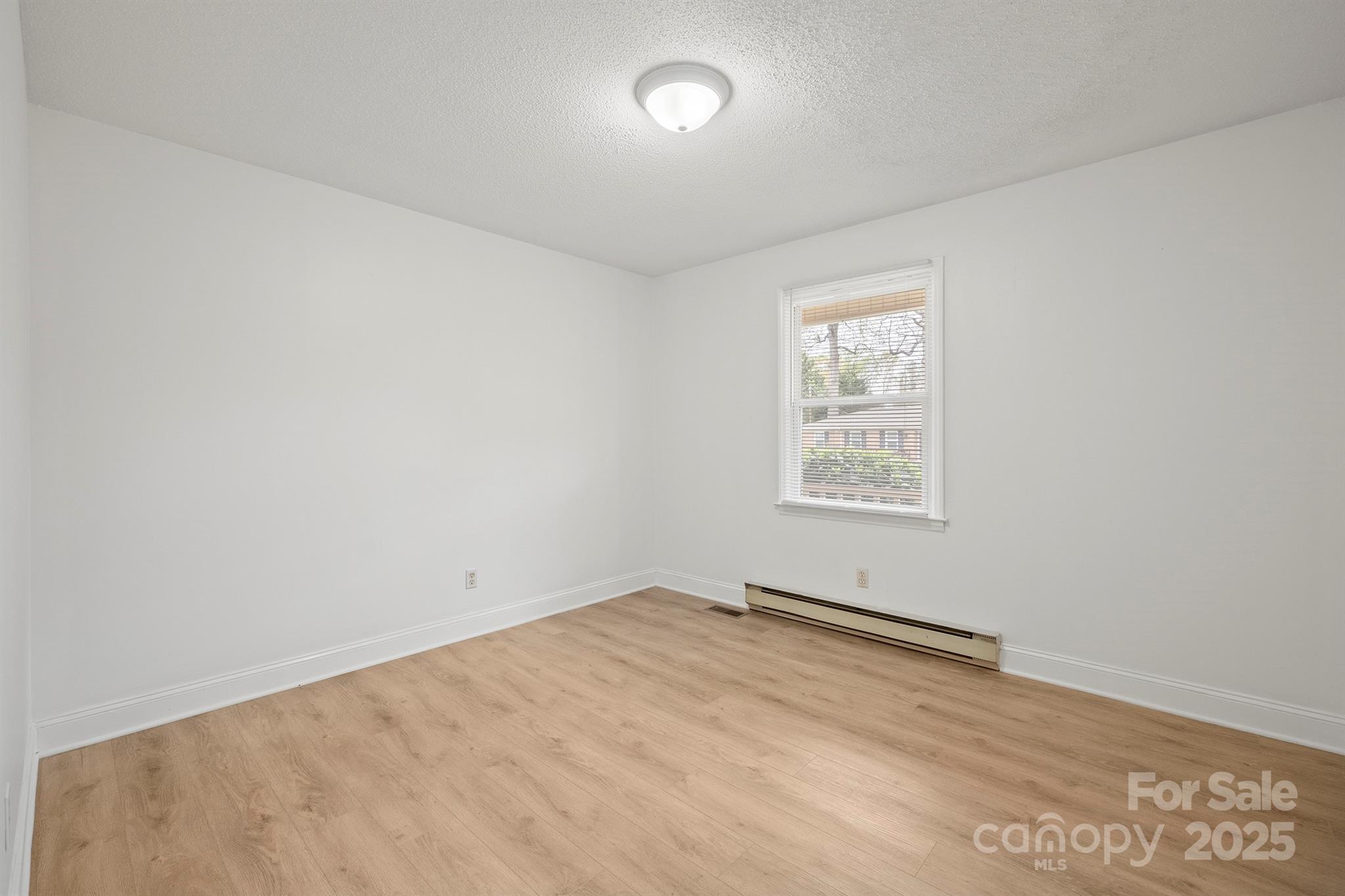 303 Windy Rush Road Kannapolis, NC 28081 - Photo 24 of 30 an empty room with a window