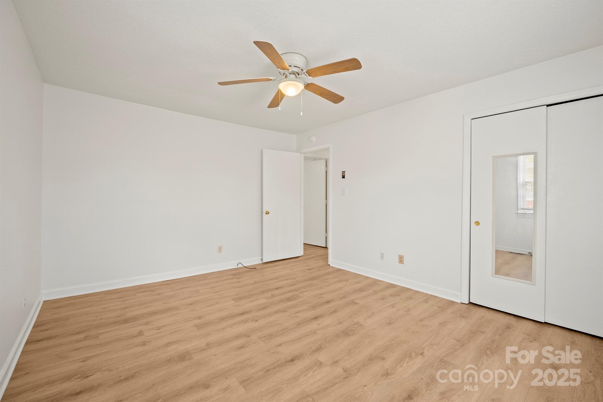303 Windy Rush Road Kannapolis, NC 28081 - Photo 27 of 30 a view of empty room with wooden floor