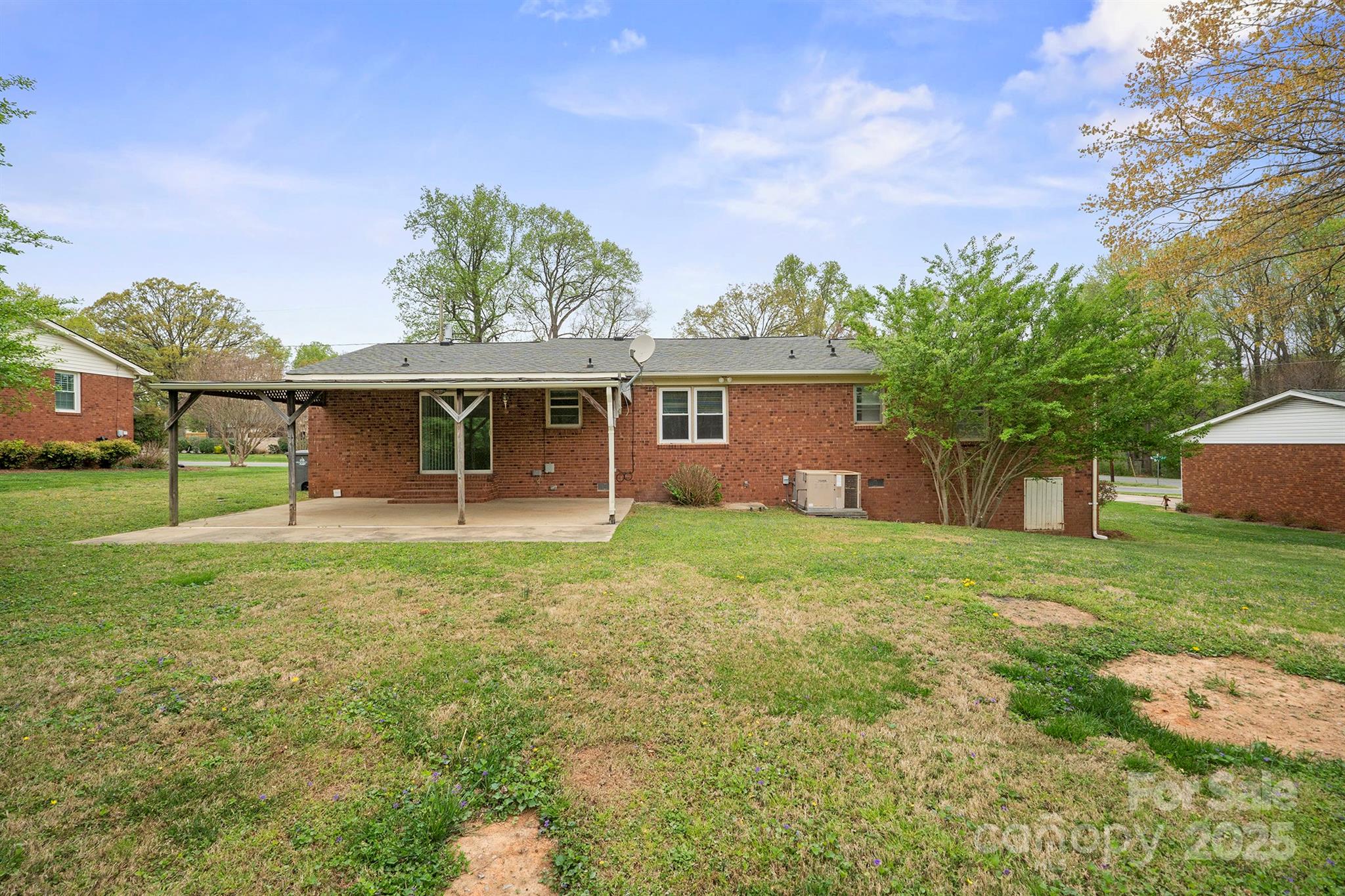 303 Windy Rush Road Kannapolis, NC 28081 - Photo 29 of 30 a view of a house with yard and a garden