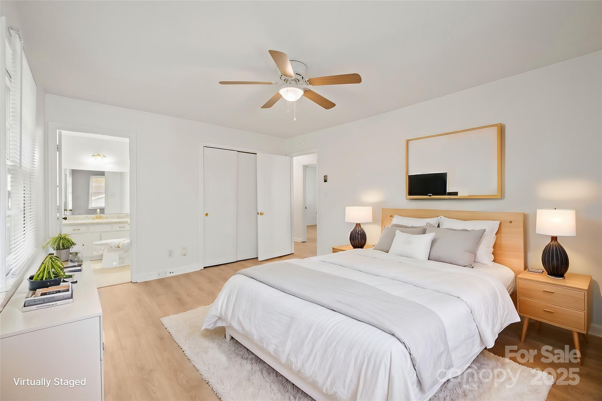 303 Windy Rush Road Kannapolis, NC 28081 - Photo 4 of 30 a bedroom with a bed and a chandelier