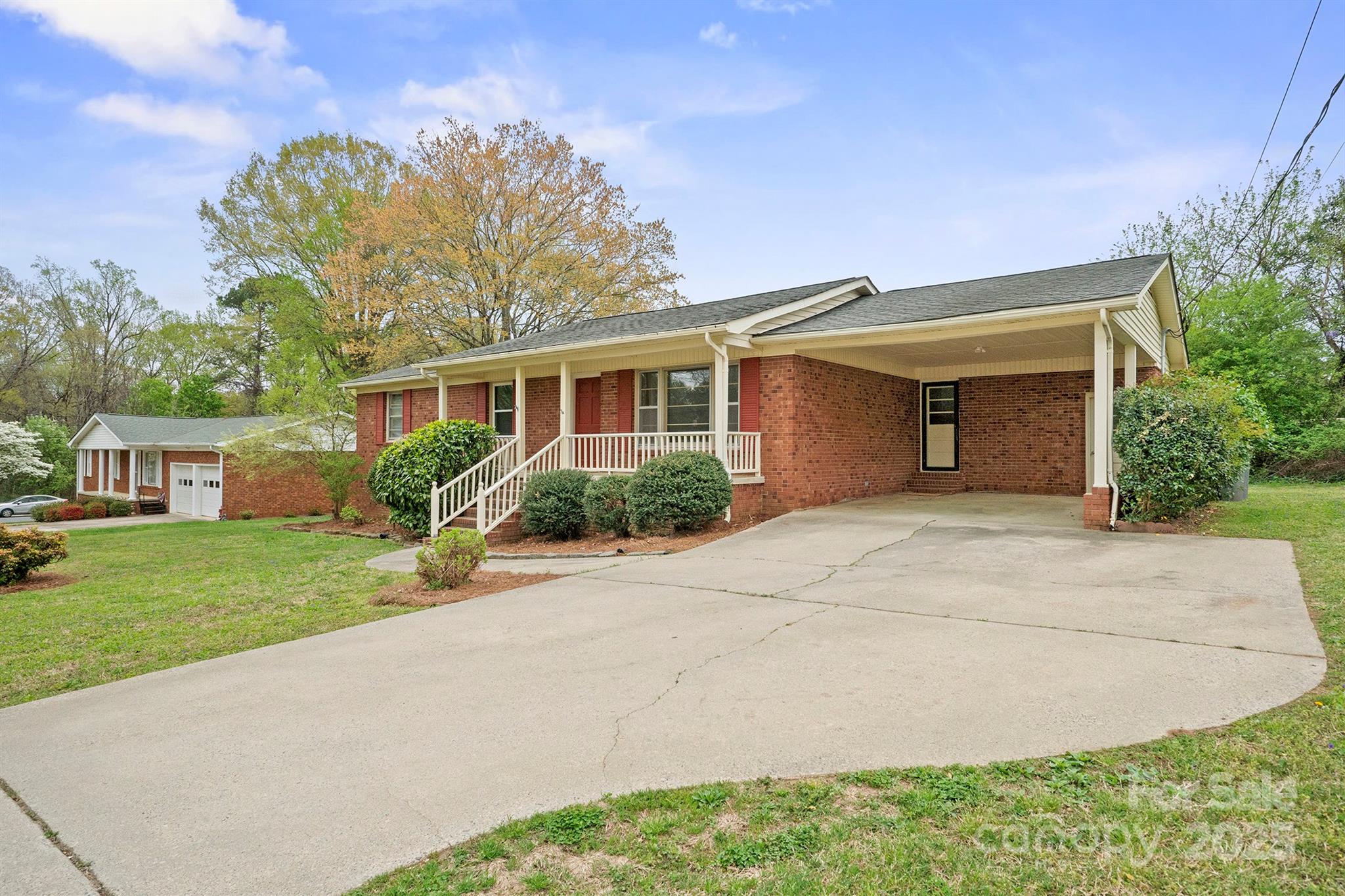 303 Windy Rush Road Kannapolis, NC 28081 - Photo 7 of 30 a front view of a house with a yard and garage