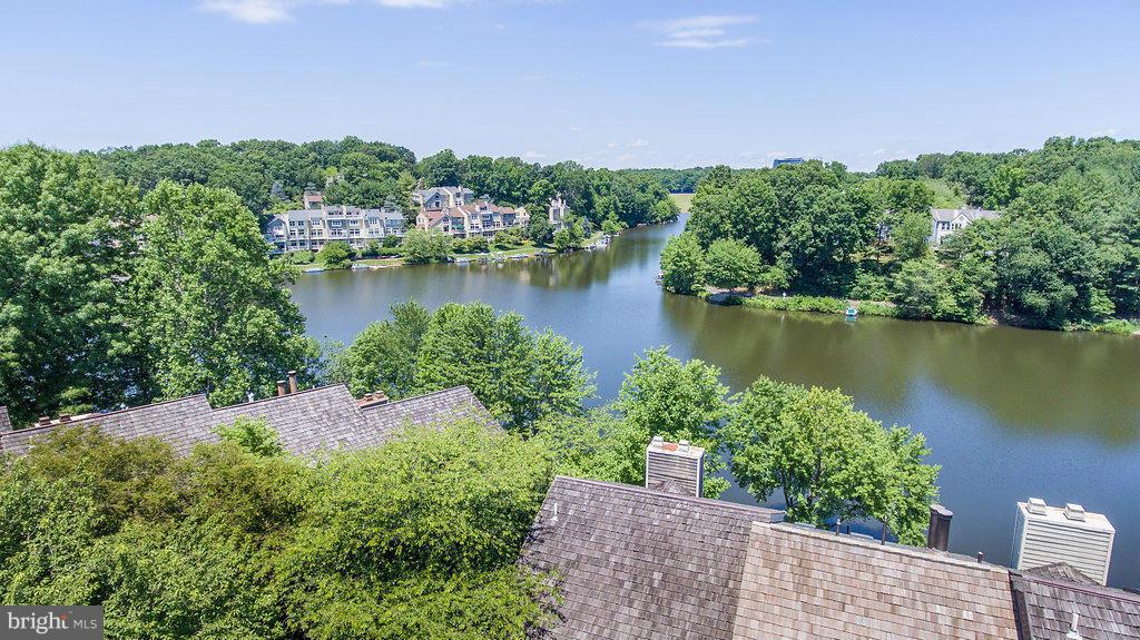 11002 Thrush Ridge Road Reston, VA 20191 - Photo 3 of 29 an aerial view of a house with a yard and lake view