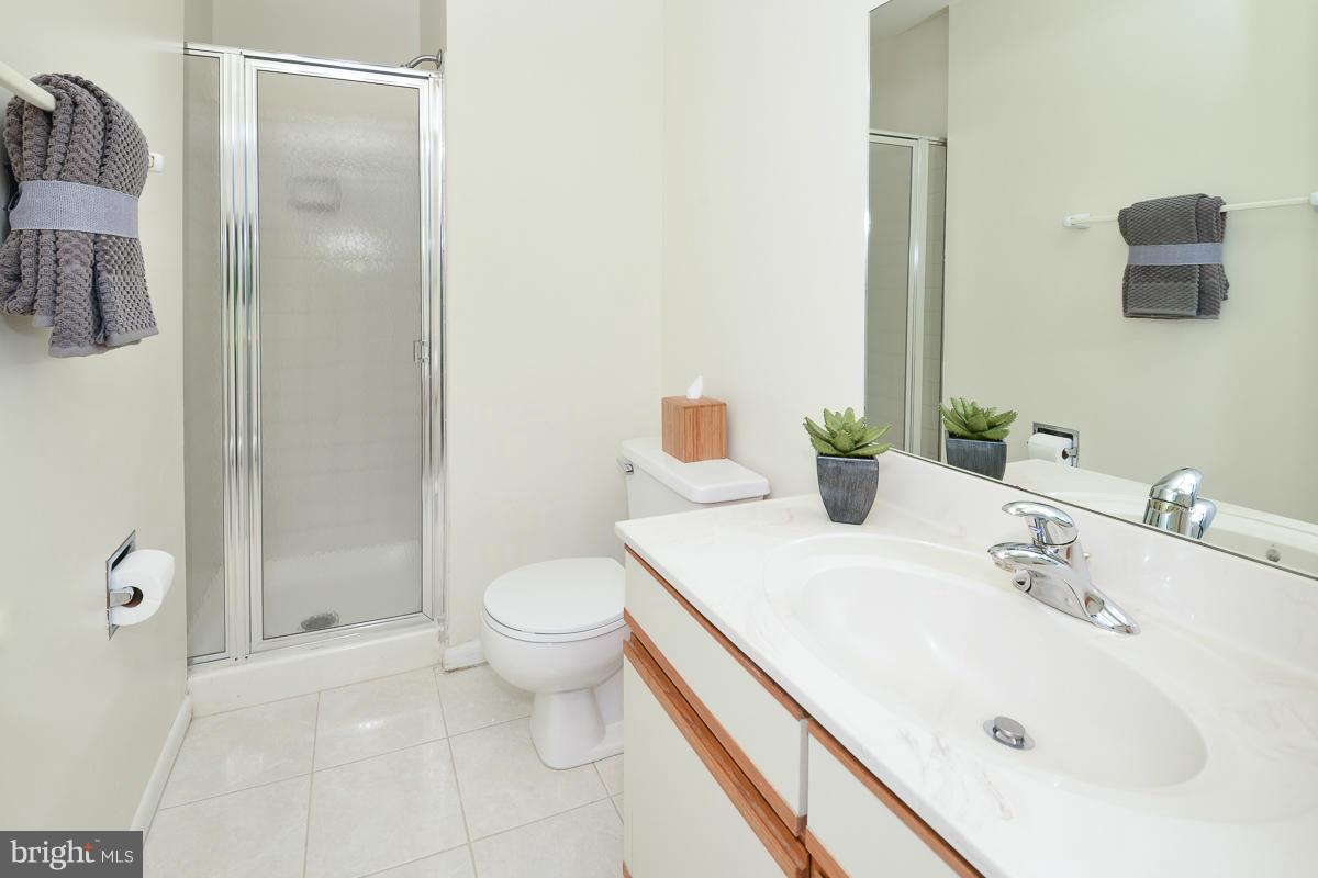 11002 Thrush Ridge Road Reston, VA 20191 - Photo 23 of 29 a bathroom with a sink and a mirror