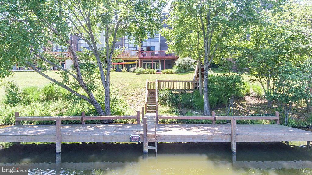 11002 Thrush Ridge Road Reston, VA 20191 - Photo 6 of 29 a front view of a house with a yard