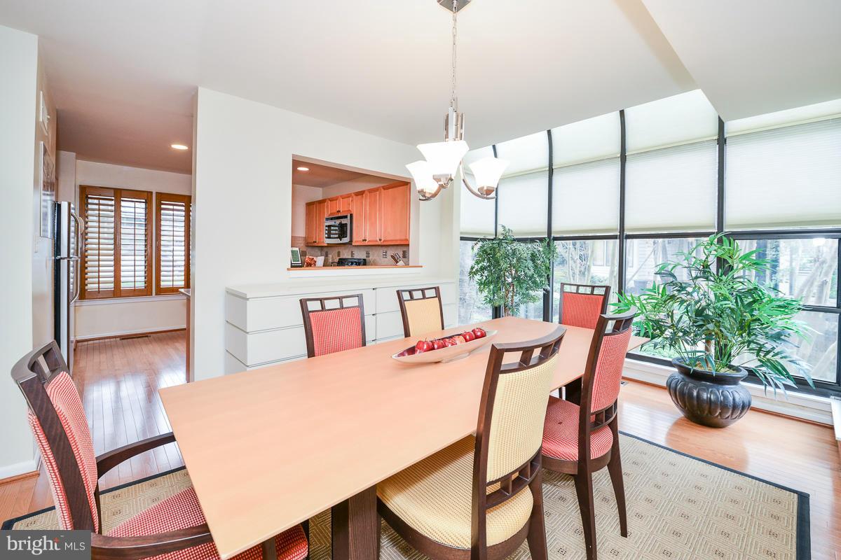 11002 Thrush Ridge Road Reston, VA 20191 - Photo 10 of 29 a view of a dining room with furniture window and wooden floor