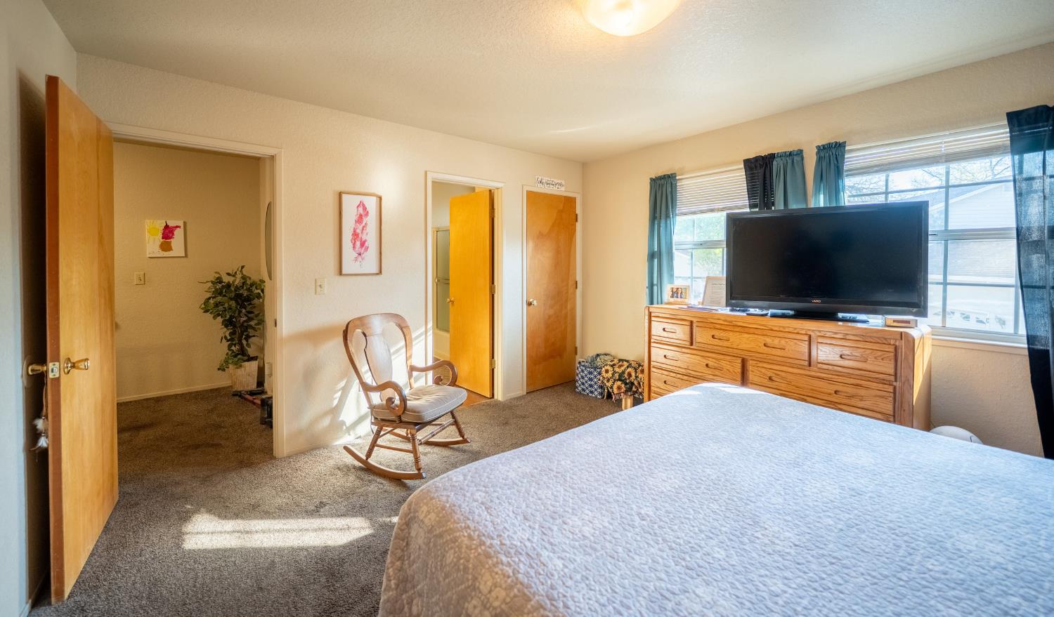494 Surrey Court Murphys, CA 95247 - Photo 69 of 76 a bedroom with a bed and a flat screen tv