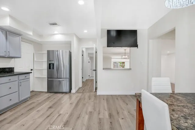 a kitchen with a sink cabinets and window