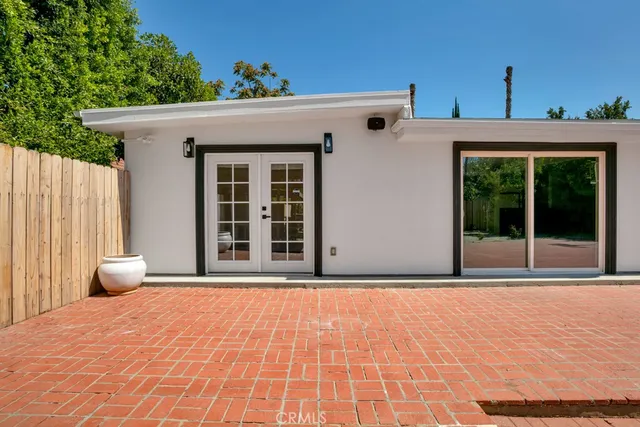 a house with a wooden fence