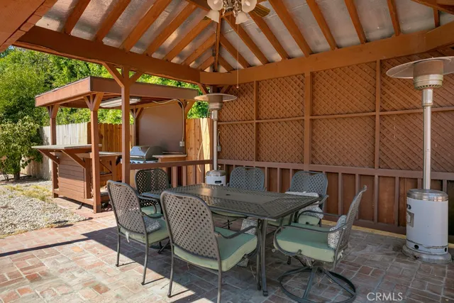 a swimming pool with outdoor seating and yard