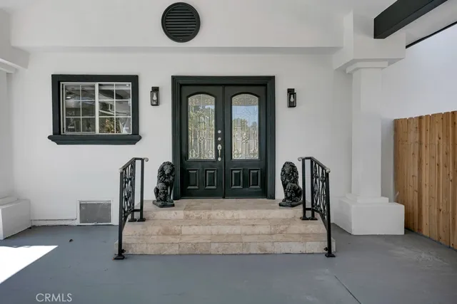 a bedroom with bed and a chair