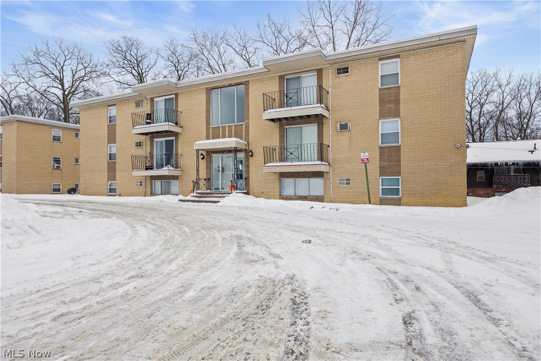 5382 Lee Road, Unit 102 Maple Heights, OH 44137 - Photo 1 of 25 Snow covered building featuring a view of apartment building / complex