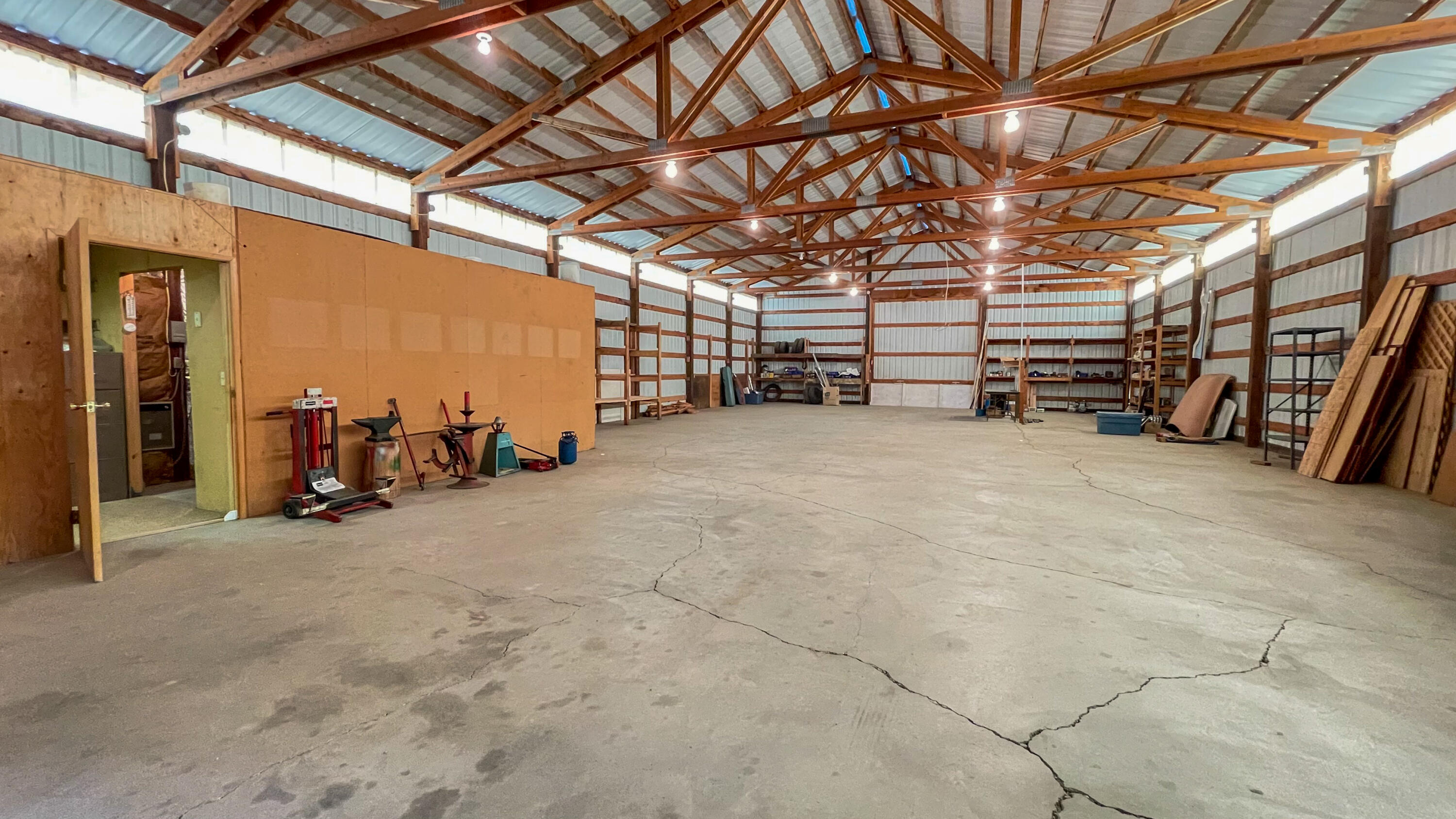 6302 Stillman Road Powell Butte, OR 97753 - Photo 10 of 39 a view of empty room with wooden ceiling