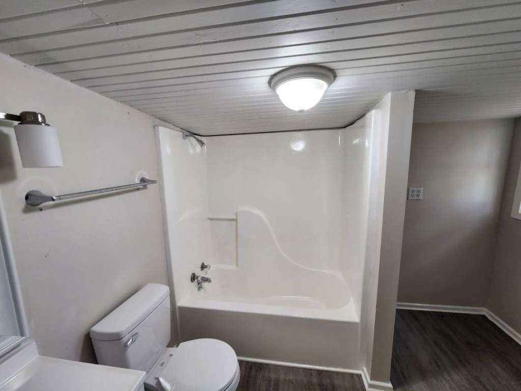 1329 Adams Road Bay City, TX 77414 - Photo 12 of 14 a bathroom with a toilet and a shower
