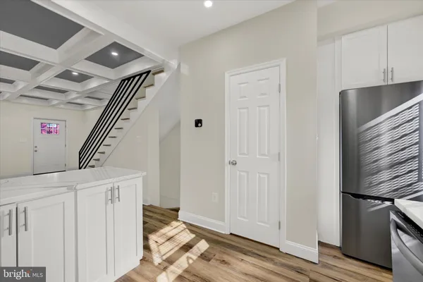 a view of an entryway with wooden floor