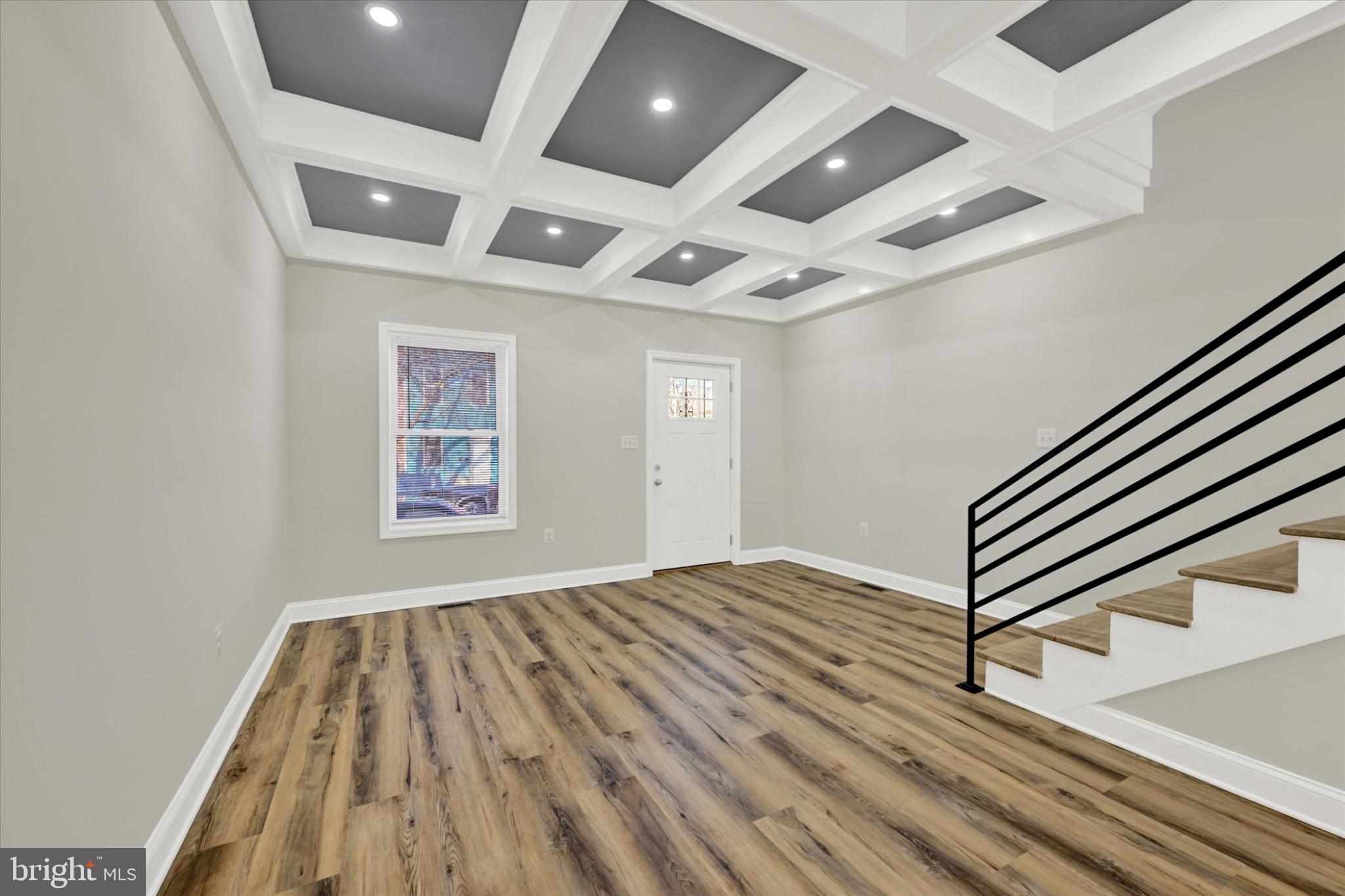 119 North Poppleton Street Baltimore, MD 21201 - Photo 37 of 41 en empty room with wooden floor and windows