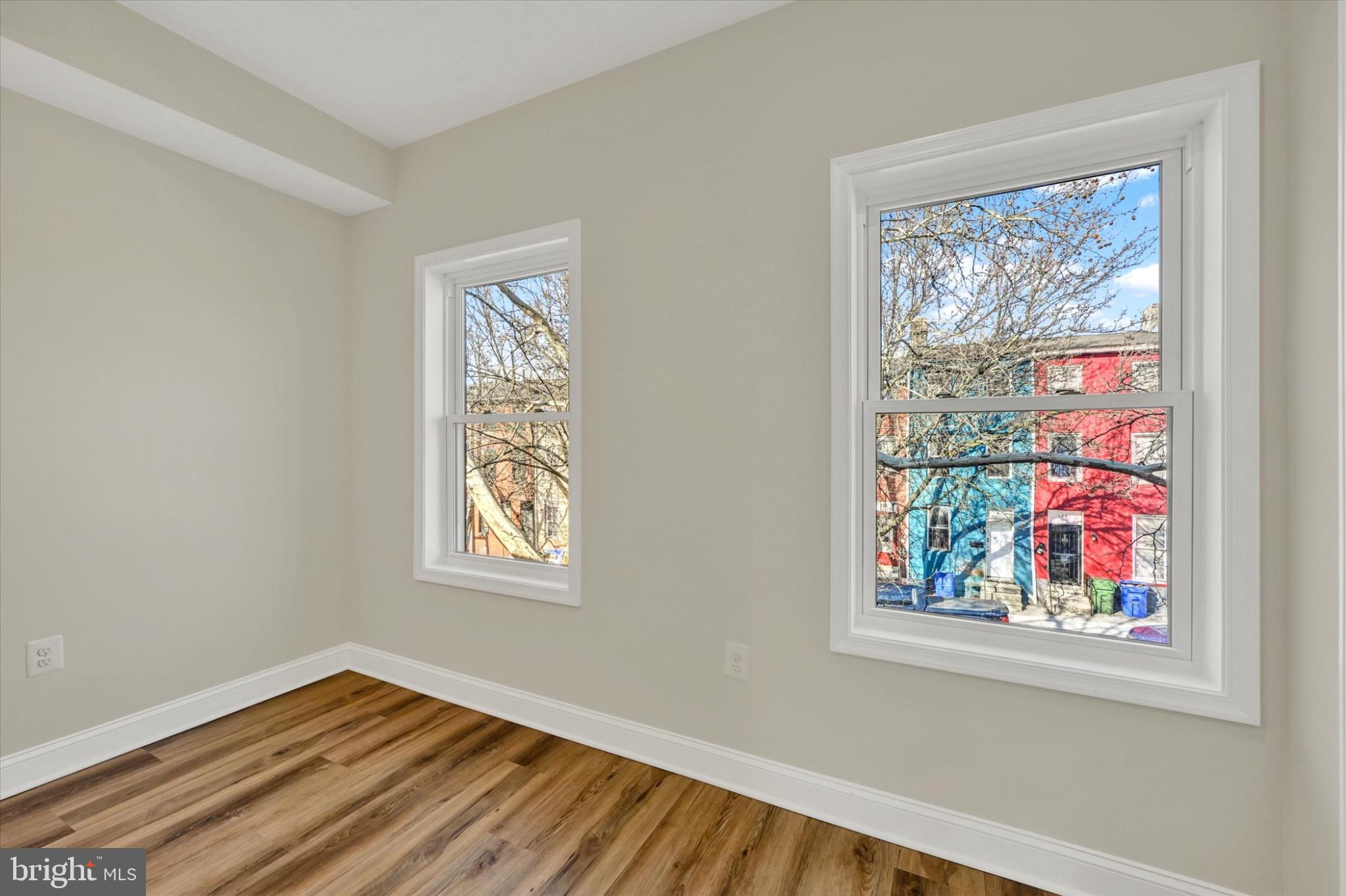 119 North Poppleton Street Baltimore, MD 21201 - Photo 40 of 41 a view of an empty room with a window and wooden floor