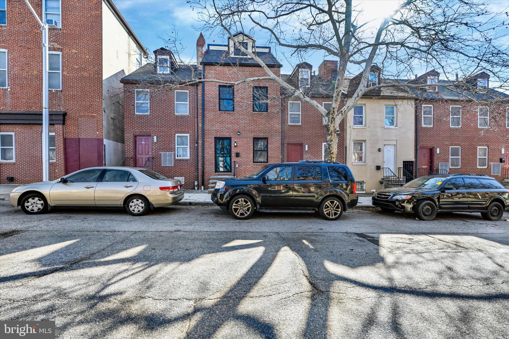 119 North Poppleton Street Baltimore, MD 21201 - Photo 7 of 41 a car parked in front of a building