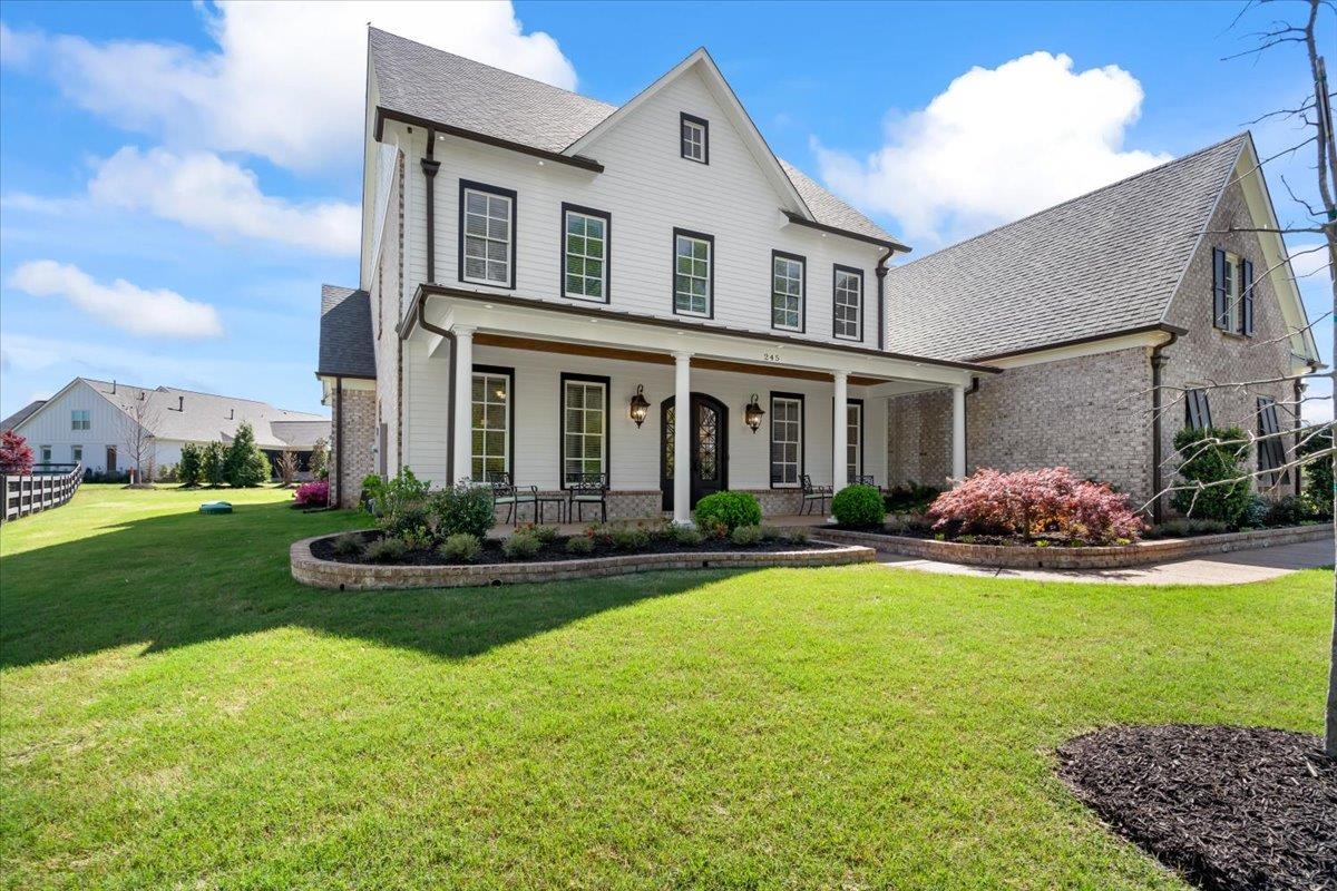 front view of a house with a yard