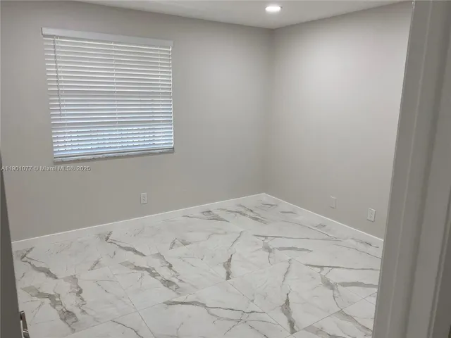 a view of a bedroom with a window