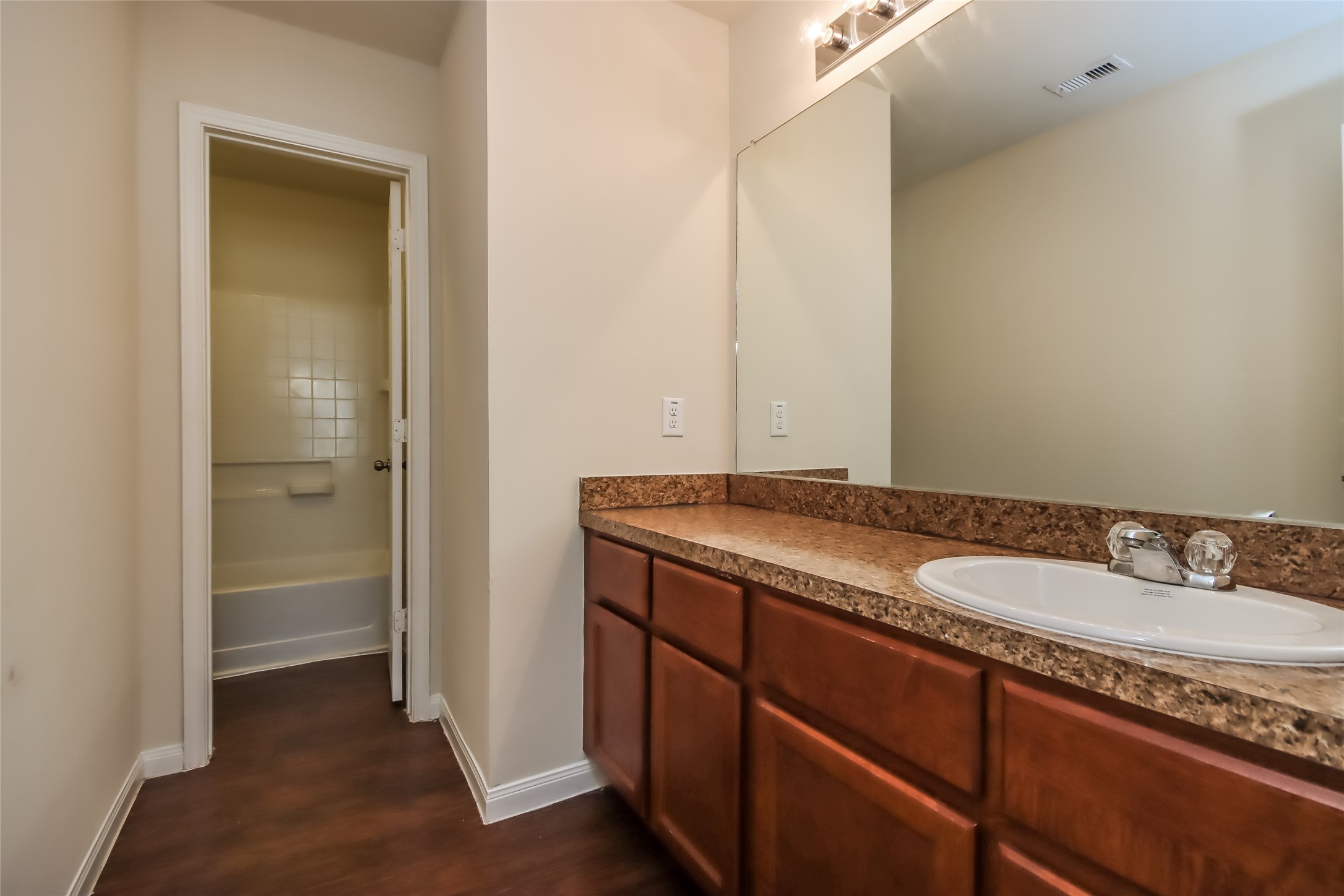 13022 Ristina Circle Houston, TX 77048 - Photo 2 of 15 a bathroom with a granite countertop sink and a mirror