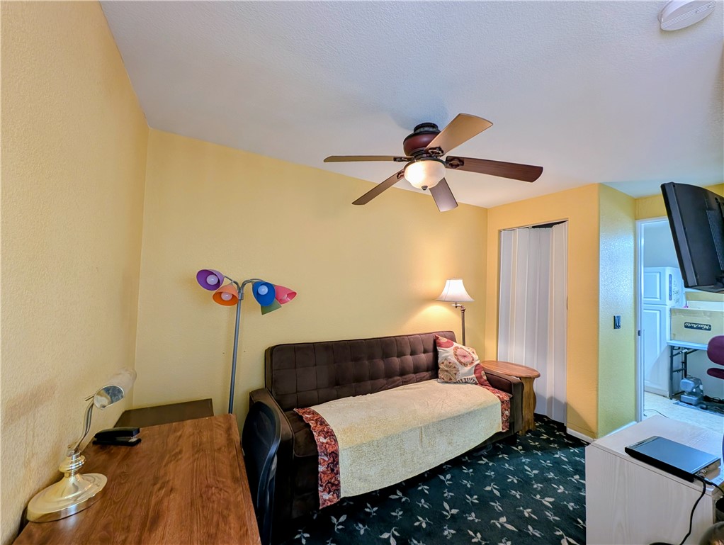 2000 Ramar Road, Unit 280 Bullhead City, AZ 86442 - Photo 25 of 63 a bedroom with a bed and a chandelier