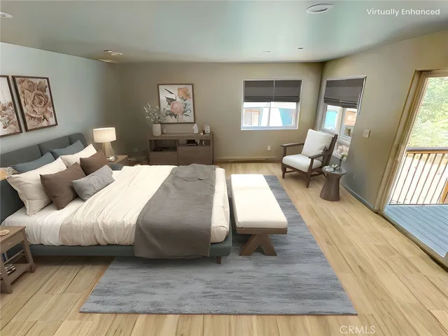 a bedroom with bed couch and window