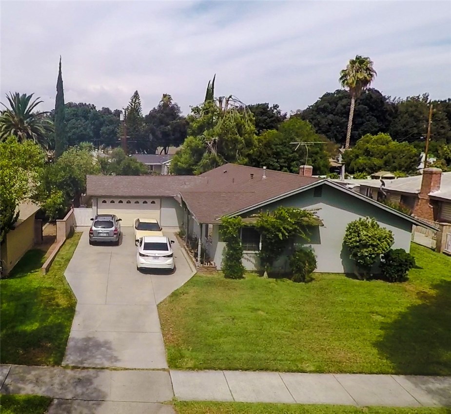 3585 Lillian Street Riverside, CA 92504 - Photo 1 of 1 a view of a house with a yard and a garden
