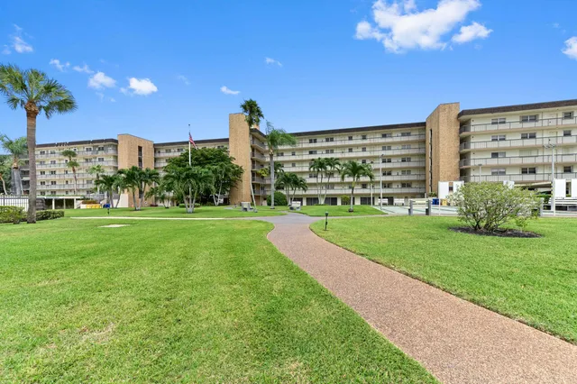 a view of a building with a yard