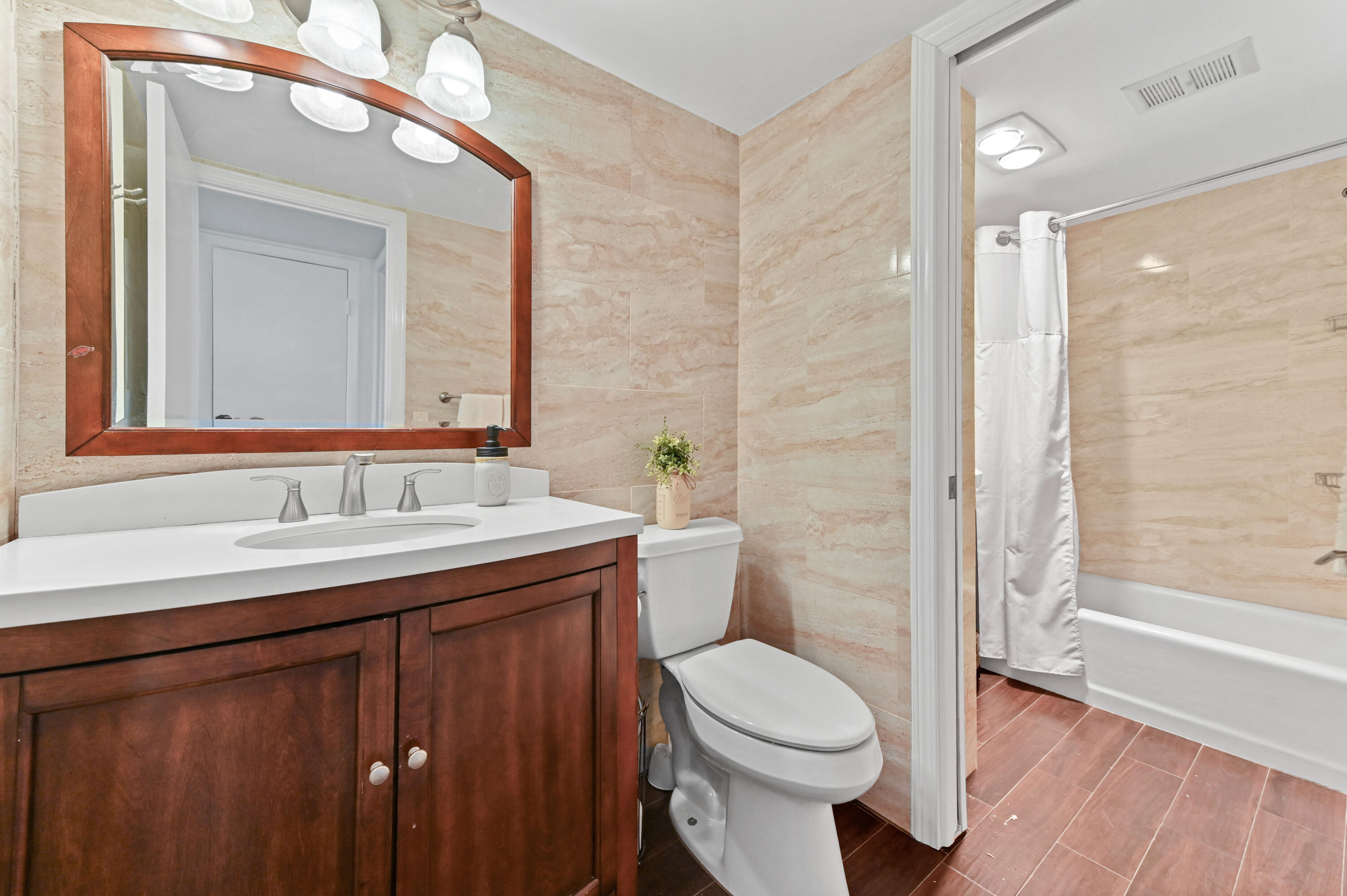 555 Northwest 4th Avenue, Unit 5070 Boca Raton, FL 33432 - Photo 15 of 29 a bathroom with a sink and a mirror