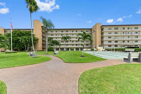 a view of a building with a yard