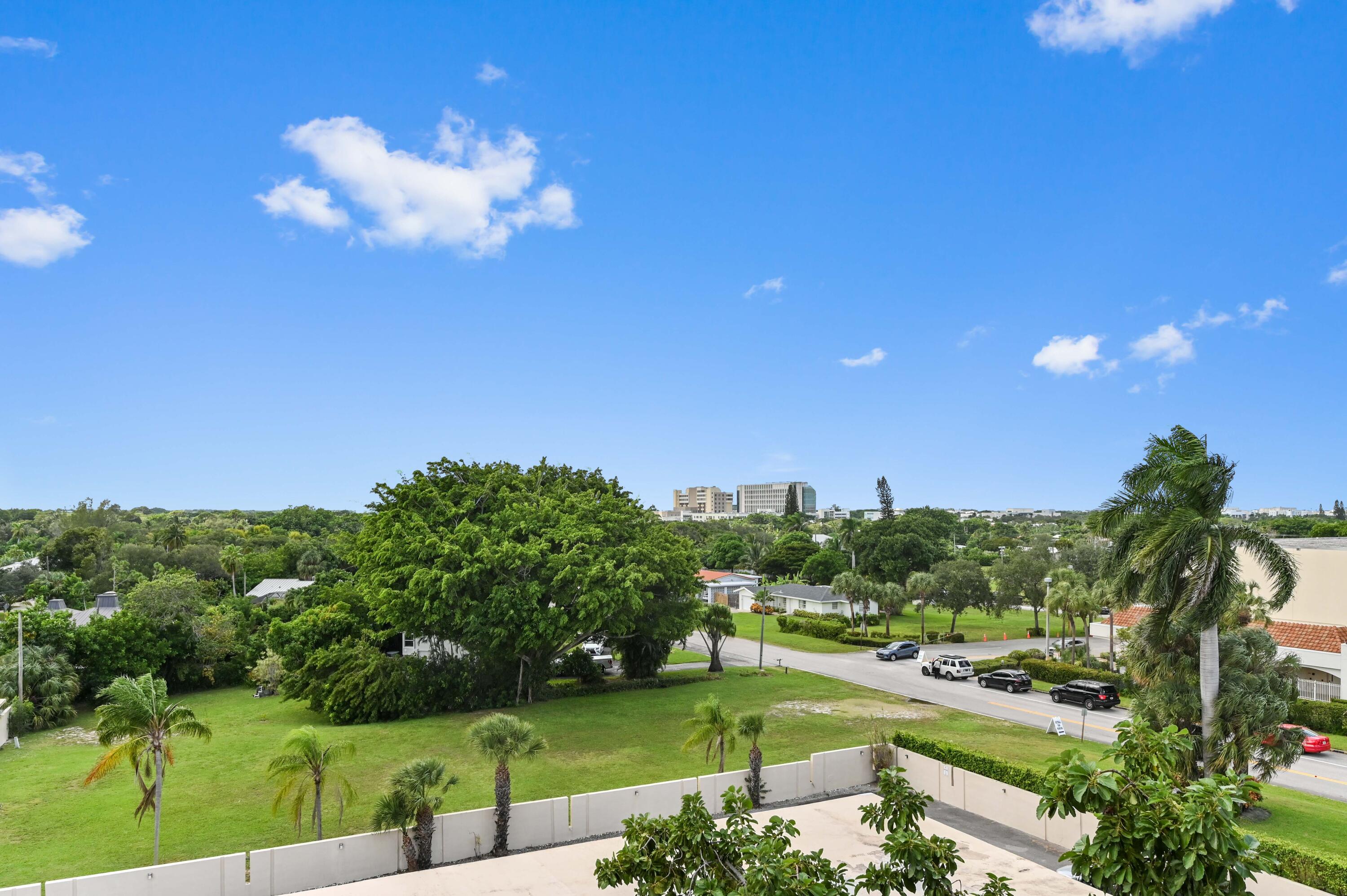 555 Northwest 4th Avenue, Unit 5070 Boca Raton, FL 33432 - Photo 24 of 29 a view of a big yard with a fountain