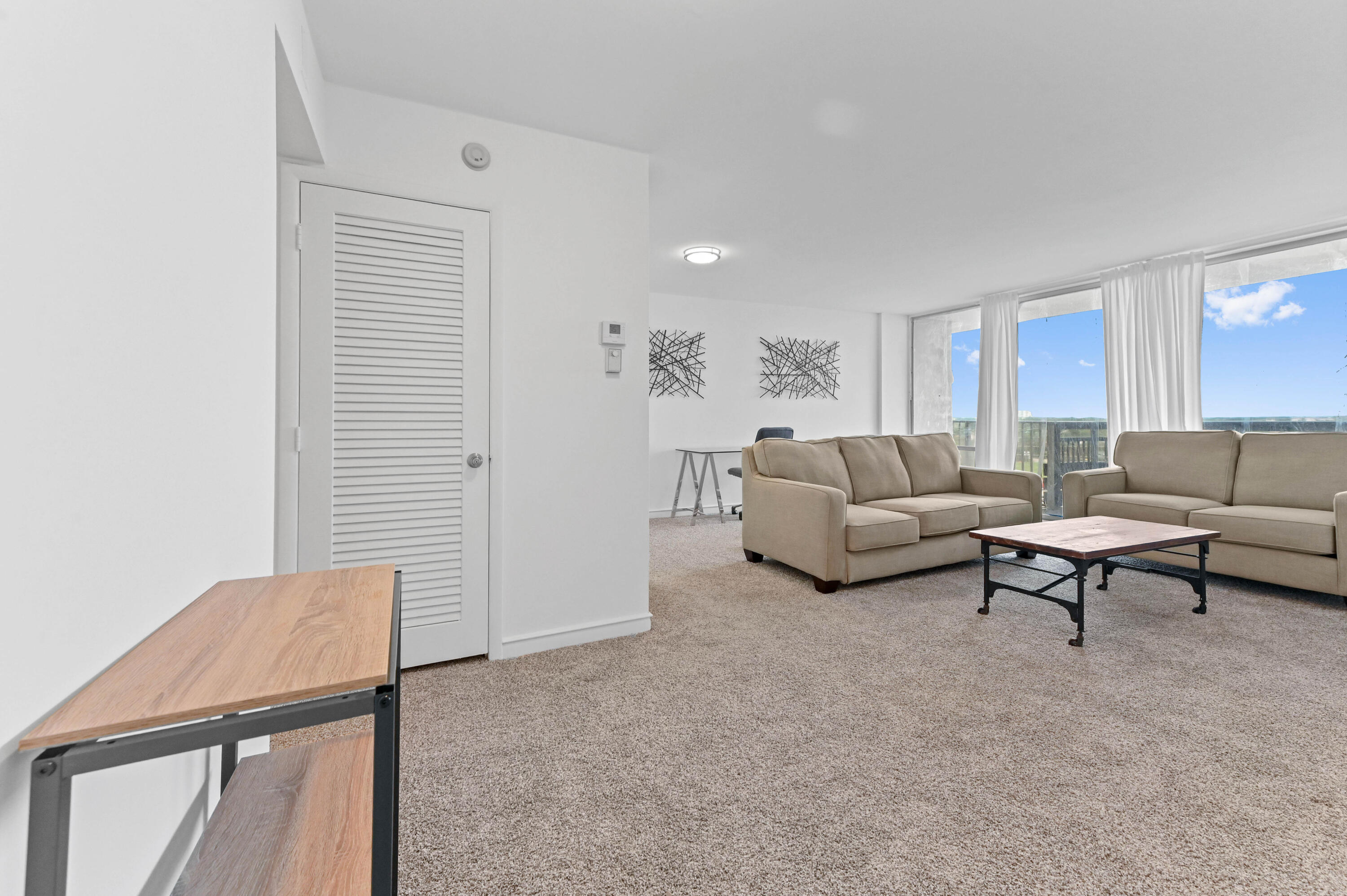 555 Northwest 4th Avenue, Unit 5070 Boca Raton, FL 33432 - Photo 3 of 29 a living room with furniture and a potted plant