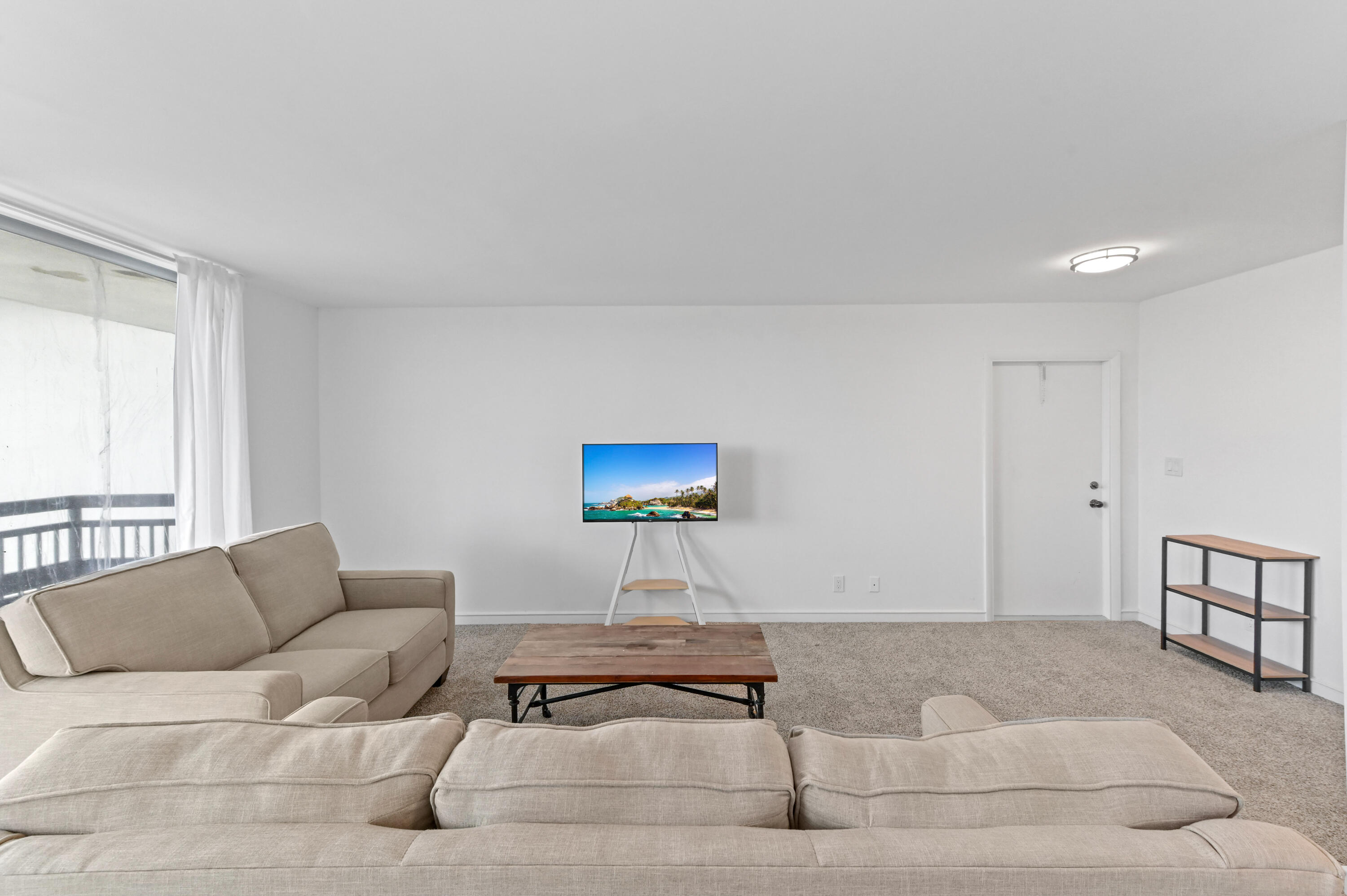 555 Northwest 4th Avenue, Unit 5070 Boca Raton, FL 33432 - Photo 5 of 29 a living room with furniture a rug and a window