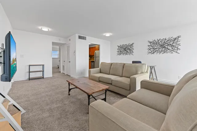 a living room with furniture and a couch