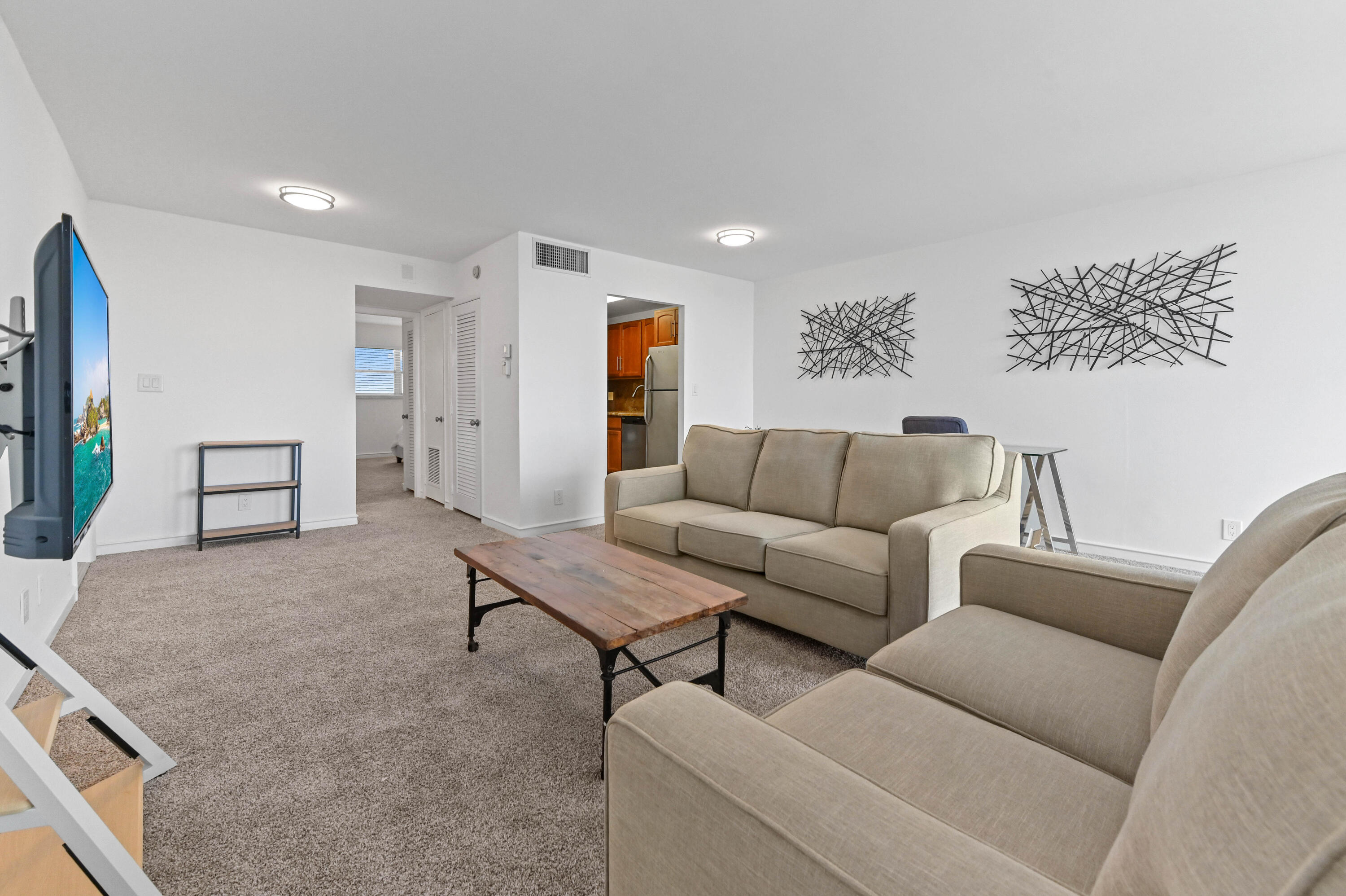 555 Northwest 4th Avenue, Unit 5070 Boca Raton, FL 33432 - Photo 7 of 29 a living room with furniture and a couch