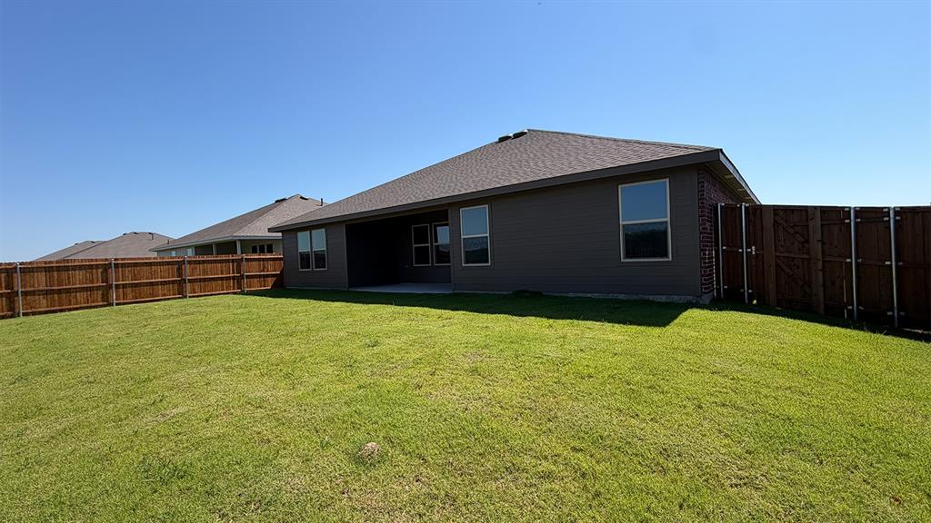 1921 Reveille Way Terrell, TX 75160 - Photo 23 of 30 a front view of a house with a yard